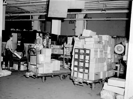 Toronto freight shed staff sorting various shipments to be transferred to express trucks