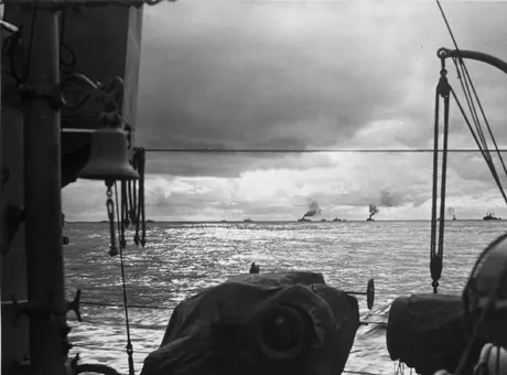 Royal Canadian Navy Destroyers shown shepherding their convoy safely into on unidentified British port at the conclusion of a successful war time Atlantic crossing