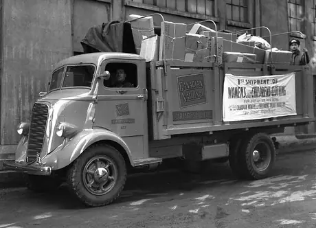 Canadian National cartage truck transporting women’s and children’s clothing for shipment overseas