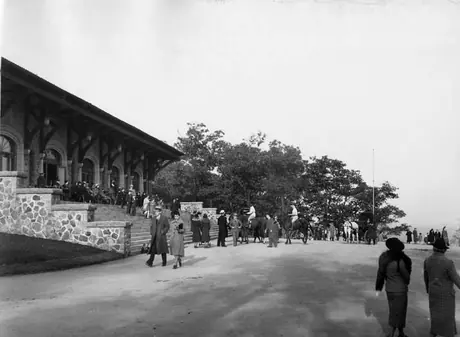 Visitors at a building on the Mount Royal lookout