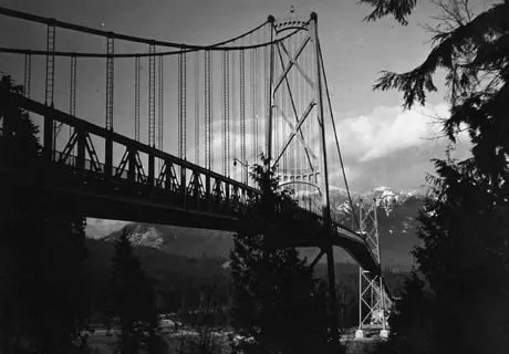 View of the Lions Gate Bridge with mountains in the background
