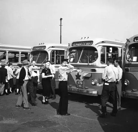 Passengers boarding buses at the CN station