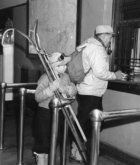 Father and son buying tickets for the ski train
