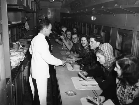 Skiers relaxing in the lunch counter car