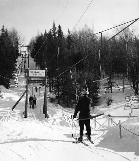 A skier taking the ski-lift