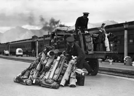 CN porters loading golf equipment onto a truck at the station
