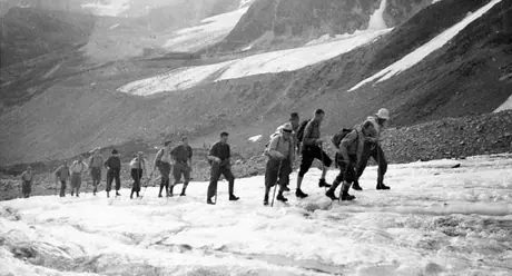Alpine Camp hikers ascending a glacier at Mount Olympus, Fryatt area