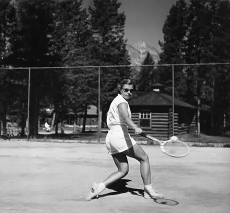 Young woman playing tennis, Jasper Park Lodge