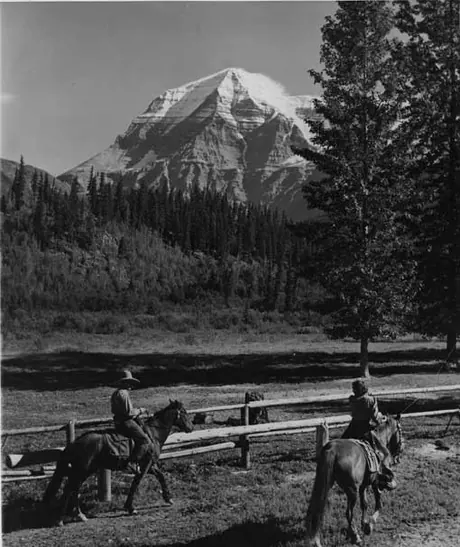 Horseback riding at Hargreaves Ranch below the CN railway line, with Mount Robson in the distance
