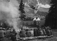 Campers relaxing around a campfire, Jasper National Park