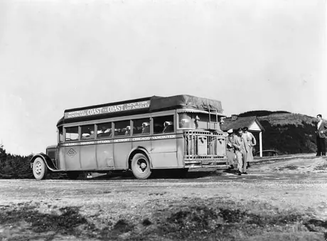 A motor bus picking up passengers at Surprise Hill, Mt. St. Anne, Percé