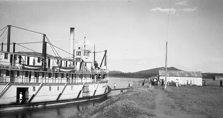 Passengers boarding a river boat, Yukon Territory