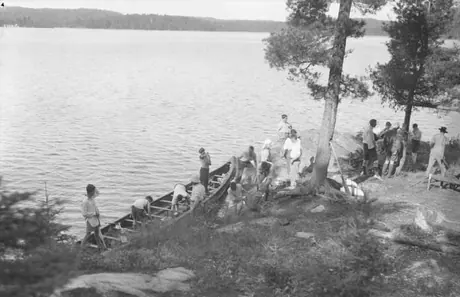 Boys preparing for a canoe trip, Camp Ahmek