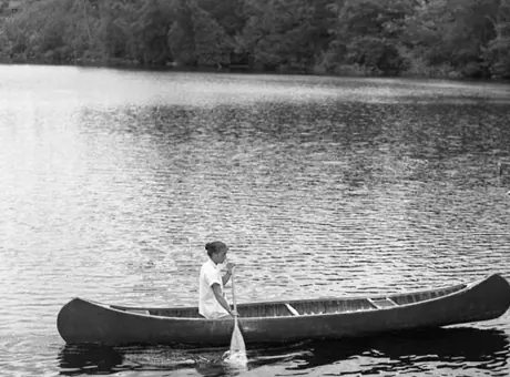 Young woman canoeing on Lake Champlain