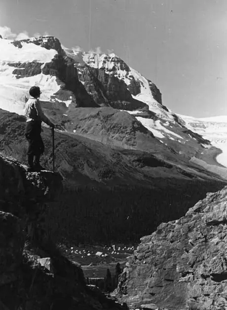 A hiker looking down over the Canadian Alpine Camp, Athabasca Glacier, Columbia Icefield