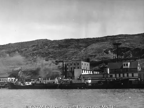 Two large dragger fishing vessels at wharf
