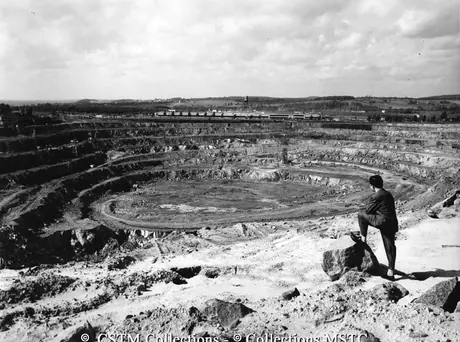 View across open pit toward manufacturing plant, Asbestos, Quebec