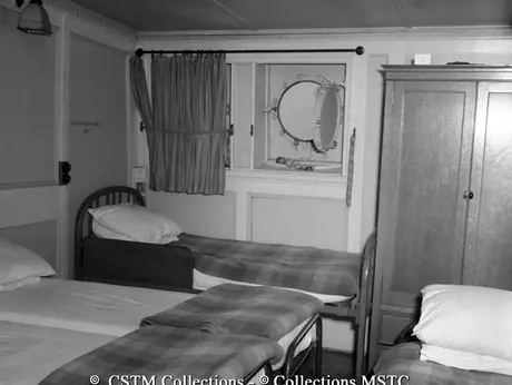 Cabin outfitted with extra beds for troops traveling on the Lady Rodney