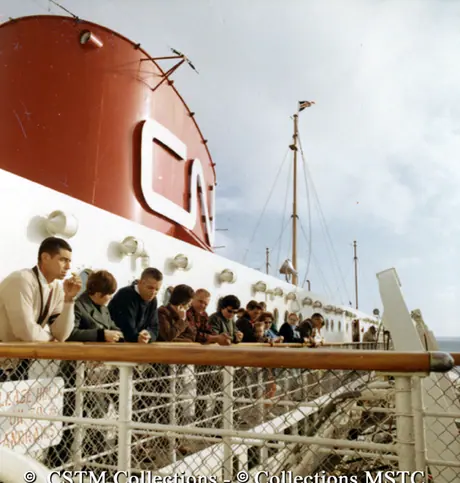 Passengers enjoying the view from the deck of the MV Bluenose
