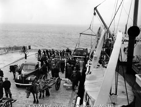 An automobile is landed from the S.S. Bar Haven, Grand Bank