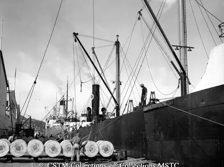 Rolls of newsprint ready to be loaded on various cargo ships