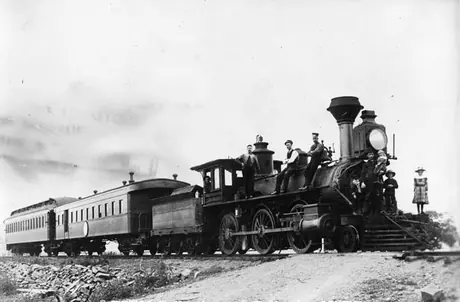 Employees and passengers posing on the first train into Dalhousie, N.B