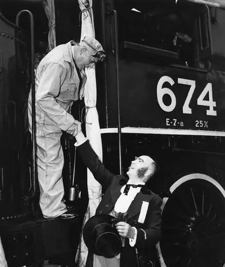 Ontario Premier Frost and Mayor Rose, of Aurora, on locomotive 647 of the Museum Train