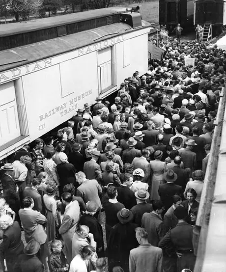 Wall to wall people line up to get a tour of the coaches of the Museum Train