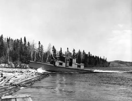 Windigo, Quebec - boat in log boom