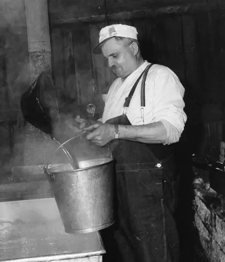 St. Scholastique, Quebec - Maple sugar - Ladling boiled syrup