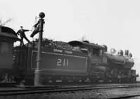Dilling the tender of Grand Trunk 4-6-2 211 with water from a stand pipe