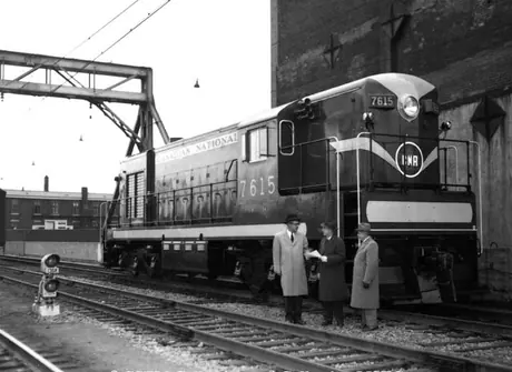 CN officials inspect new Y-2-b diesel locomotive 7615 at Central Station.  Model H12-44 built by Canadian Locomotivbe Company in 1951