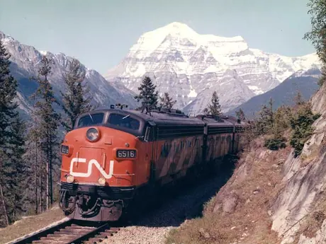 Diesel locomotive FP-9A 6516 with the Super Continental near Mount Robson.  The locomotive is fitted with ditch lights