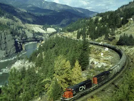 Two SD-40 diesel locomotives with a westbound unit train of potash