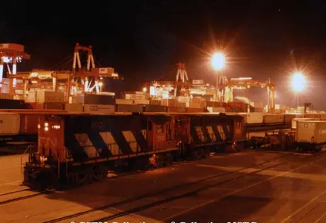 Diesel locomotive MR-14 1060 switching at night at Halterm container terminal.  Locomotive built by Montreal Locomotive Works, later fitted with 3 axle trucks