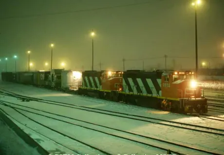 General Motors GP40-2 locomotives 9552 and 9451 arrive at Tascherean Yard with a freight train