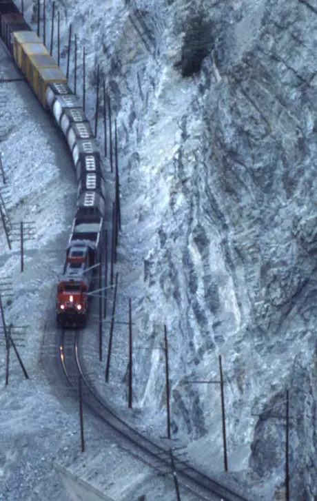 Freight train east of Lytton, B.C. with slide fence and ditch lights