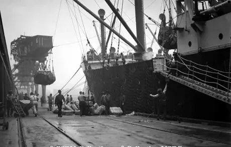 Cargo shipment of silk being loaded on Canadian National silk train no. 5116