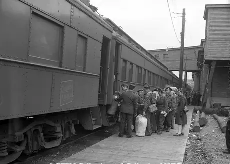 Troops returning from overseas board one of the many passenger cars in Halifax freight yard