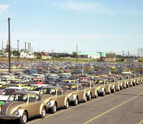 Cars lined up prior to loading on tri-level cars