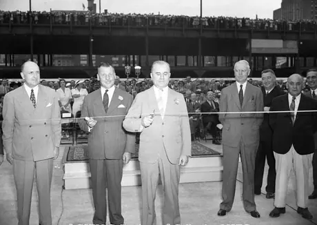 Montreal Station - Cutting ribbon - right to left; Vaughan, Mayor Raynault, Hon. J.E. Michaud, Director C.H. Read, Director Gagnon, Hon. Bouchard