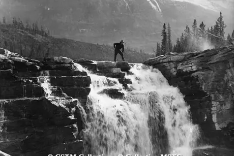 Athabasca Falls showing man on top of rock