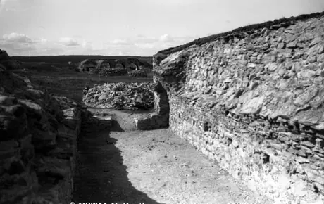 Old Fort reconstruction work - old casemate being dug out looking across the parade ground